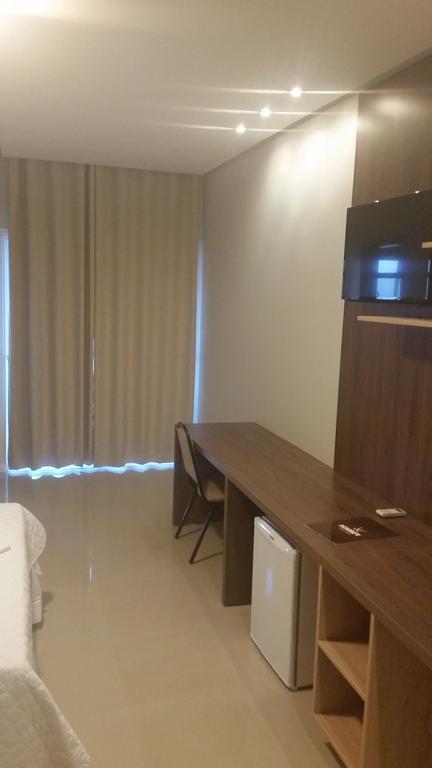Kamur Plaza Hotel Гоянезия Номер фото
